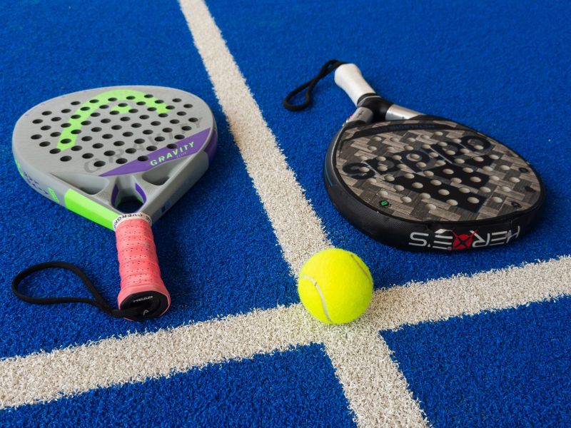 Padel rackets and padel ball on padel court
