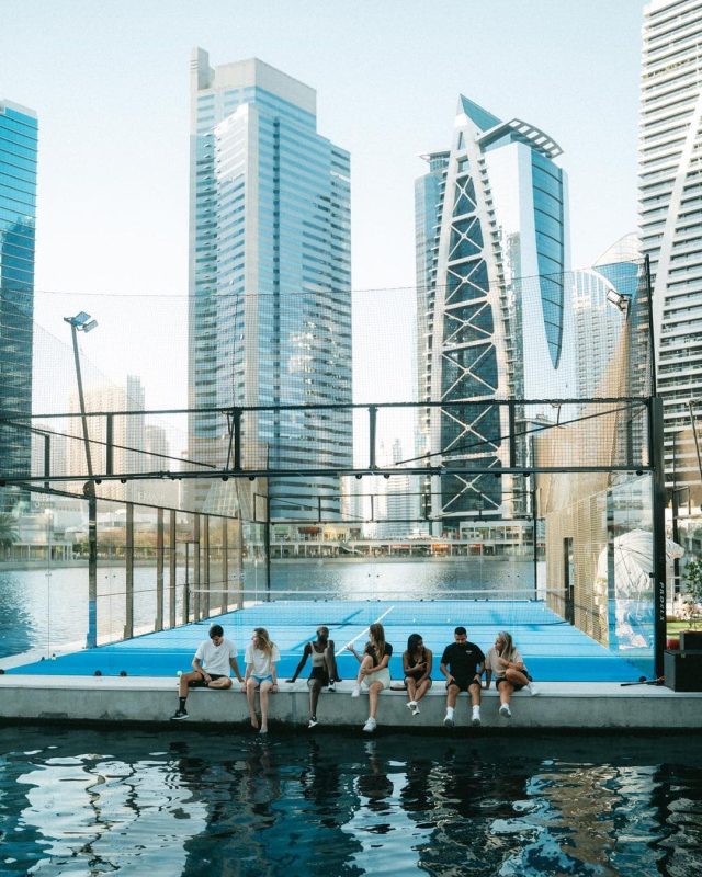 a floating padel tennis court with padel players