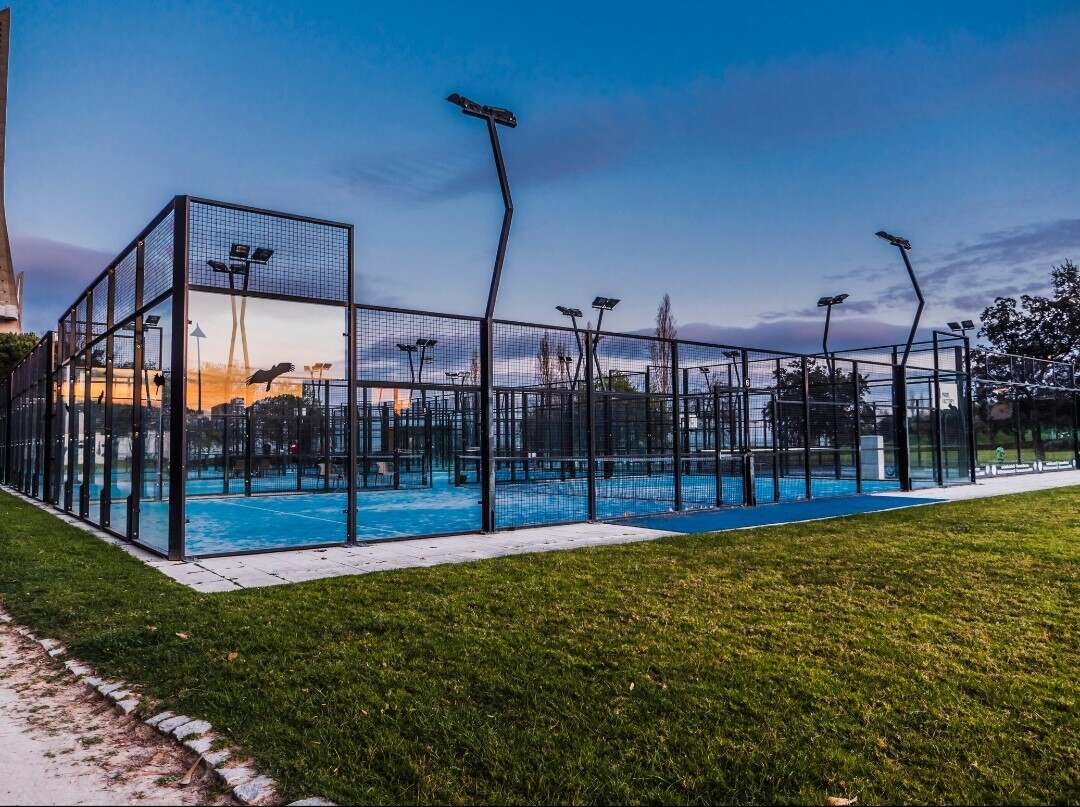Outdoor padel courts at dusk